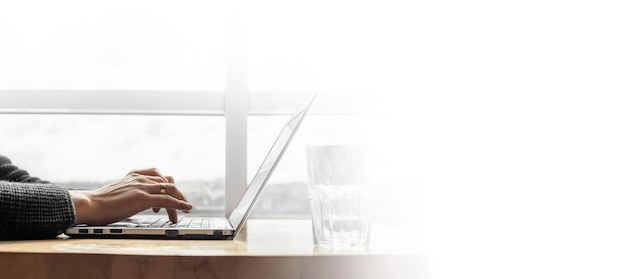 A businessman working in an office with large windows