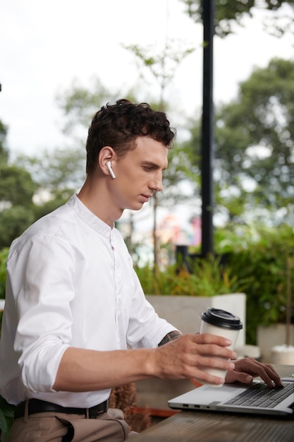 Businessman Working in Outdoor Cafe