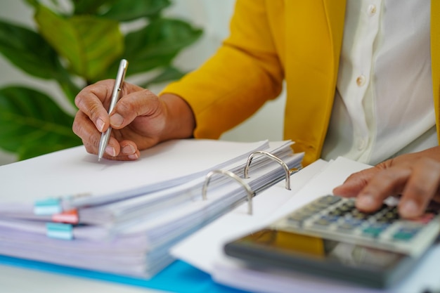 Businessman working and prepare paperwork report data to analysis information in file binder at office