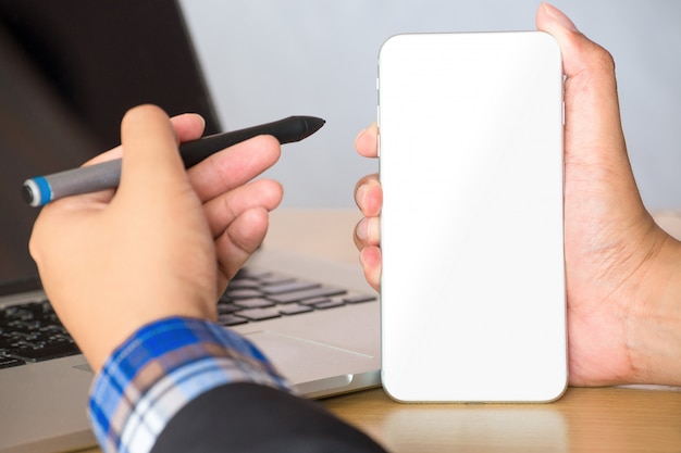 Businessman working with blank mobile phone.