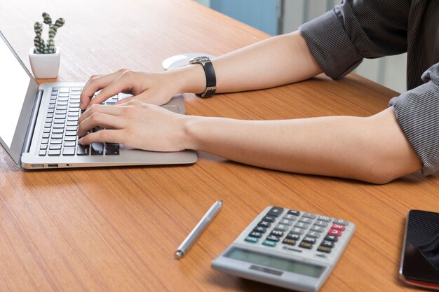 Businessman working with computer laptop on office desk