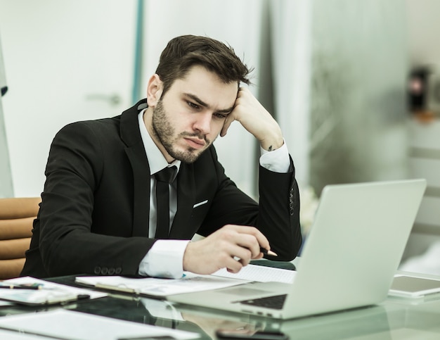 Businessman working with financial documents at Desk