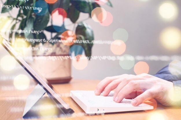 Businessman working with laptop computer on wooden desk in modern office Programmers and cyber security technologies design