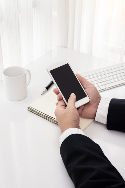 Businessman working with modern devices, computer and mobile phone