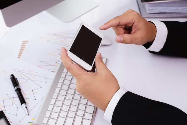 Businessman working with modern devices, computer and mobile phone