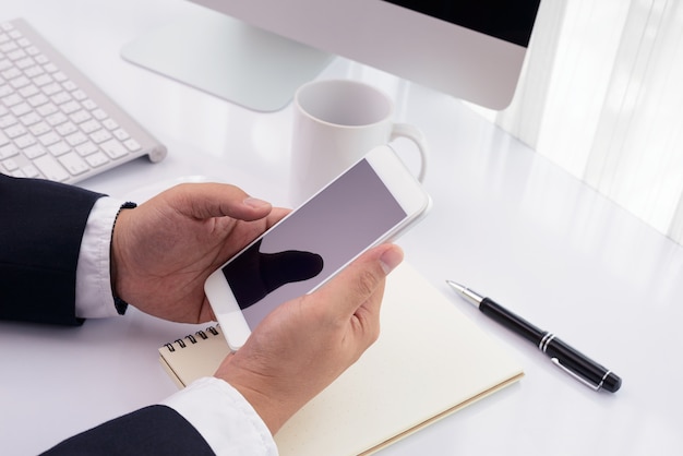 Businessman working with modern devices, computer and mobile phone