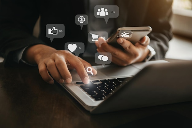 Businessman working with smartphone and digital laptop computer