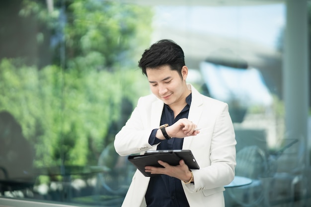 Businessman working with tablet in the cafe, business concept