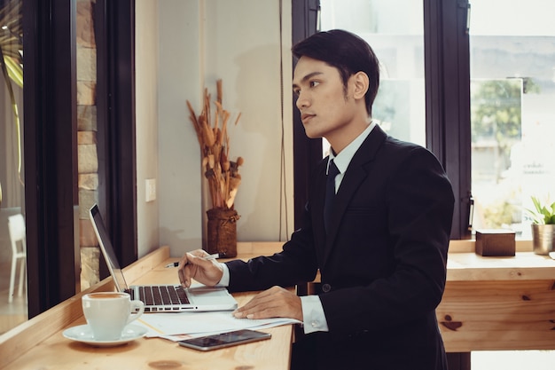 businessman works on laptop at his office