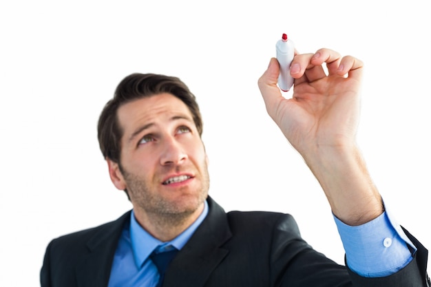 Businessman writing with red marker  