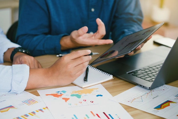 Businessmen are analyzing market data to partners have been informed brainstorming discussing