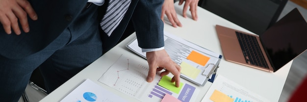 Businessmen discussing business figures at their desk small and medium business development