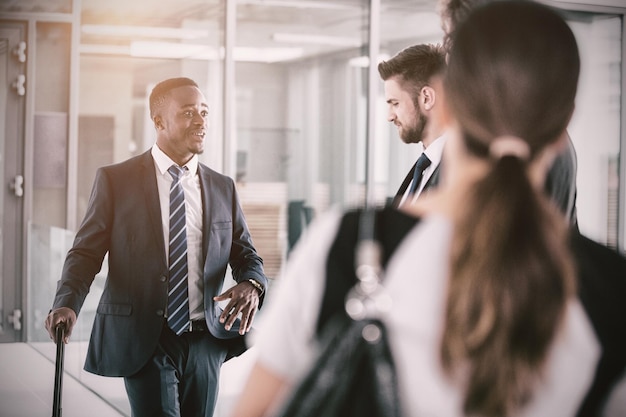 Businessmen having conversation while standing