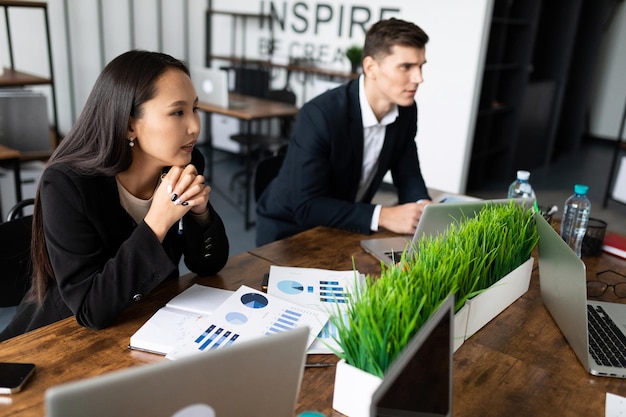 Businessmen sitting at the table during negotiations in the office