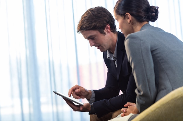 Businessmen using a tablet