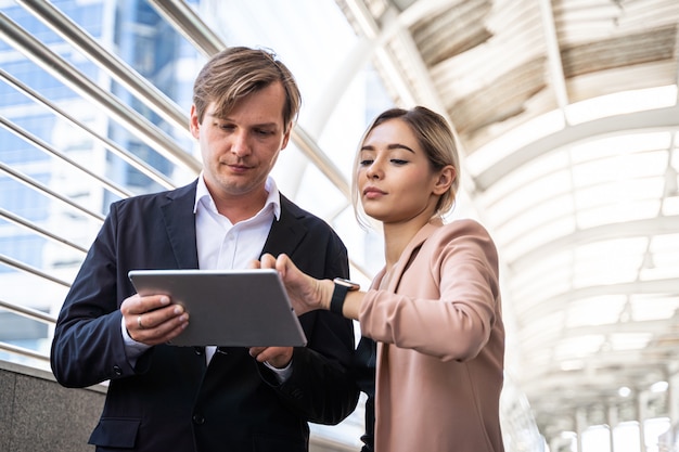 Businesspeople meeting discussing with using digital tablet