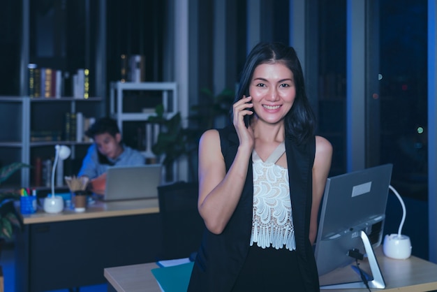 Businesspeople in the office at night