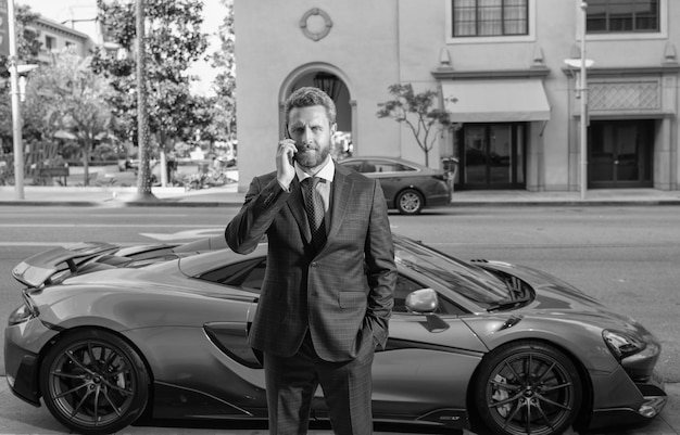 Businessperson rent a luxury car by phone