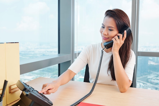 Businesswoman answering phone