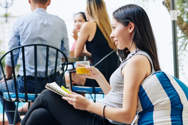 Businesswoman attending brunch with colleagues