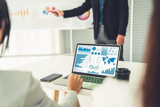 Businesswoman in business meeting using laptop computer proficiently at office