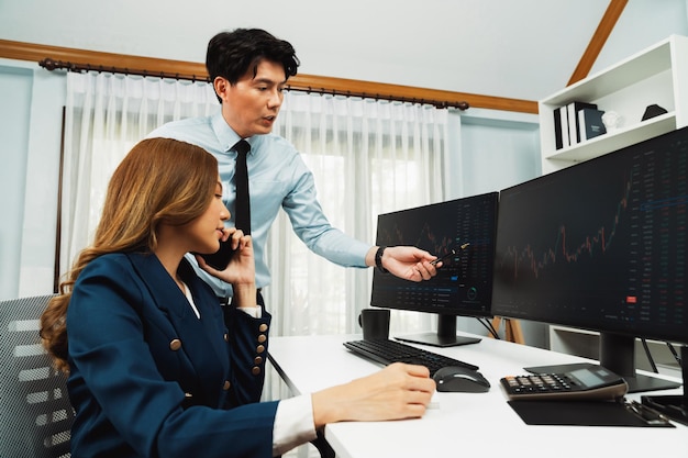 Businesswoman calling to broker in stock with woman pointing data infobahn