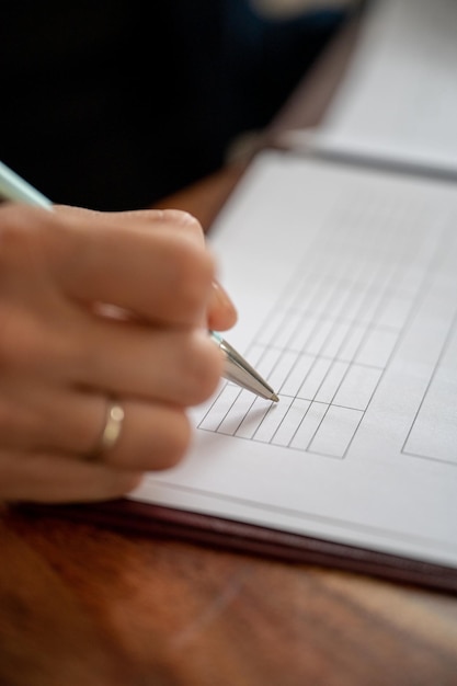 Businesswoman filling data in a table