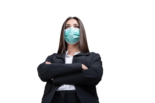 Businesswoman folding her arms in front of a white background