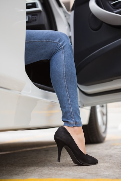 Businesswoman getting out the front door