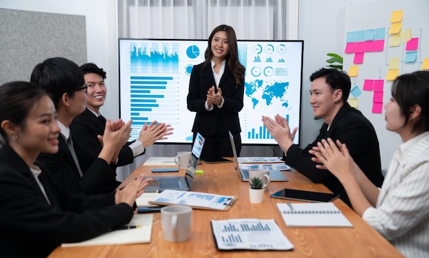 Businesswoman give presentation on dashboard data on screen at harmony office