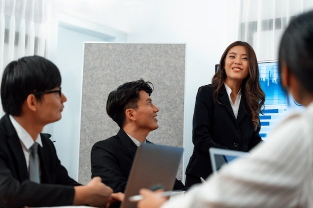 Businesswoman give presentation on dashboard data on screen at harmony office