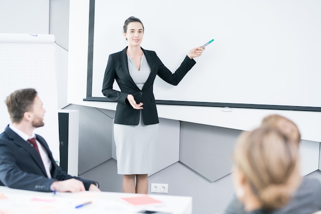 Businesswoman Giving Speech in Office