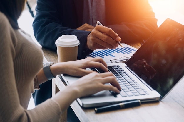 Businesswoman hand working with laptop computer tablet and smart phone in modern office with virtual icon diagram at modernoffice in morning light