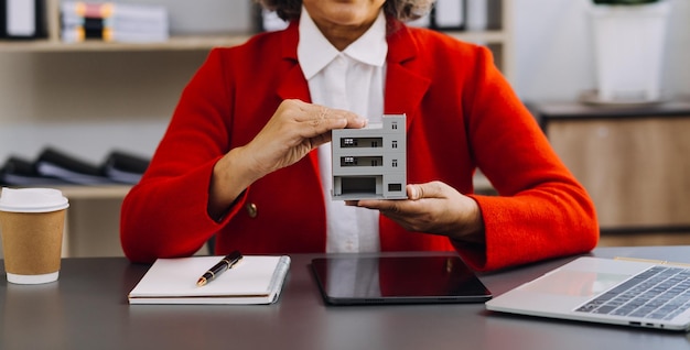 Businesswoman hand working with laptop computer tablet and smart phone in modern office with virtual icon diagram at modernoffice in morning light