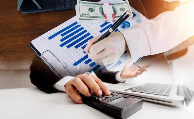 Businesswoman hand working with laptop computer tablet and smart phone in modern office with virtual icon diagram at modernoffice in morning light