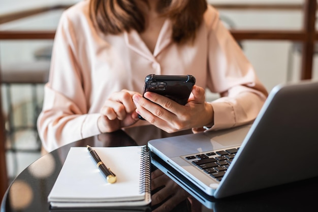 Businesswoman hand working with new modern computer using on smartphone and tablet as conceptxAxA