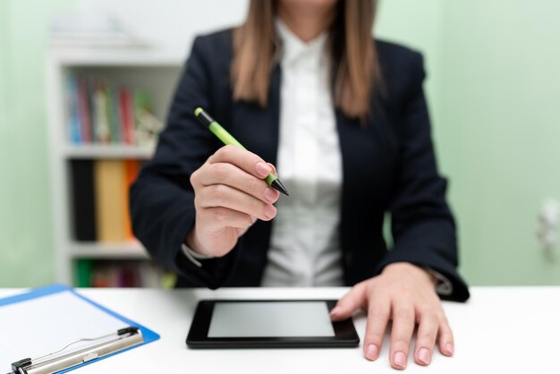 Businesswoman Having Tablet On Desk And Pointing Important Ideas With Pencil Woman With Phone Showing Recent Updates Executive Displaying Late News