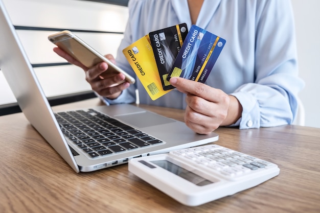 Businesswoman holding credit cards