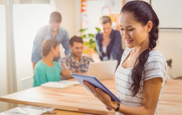 Businesswoman holding a tablet in the office