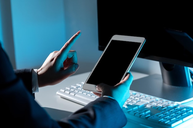 Businesswoman Holding Tablet And Pointing With One Finger On Important Message Executive In Suit Presenting Crutial Information Woman Showing Critical Announcement