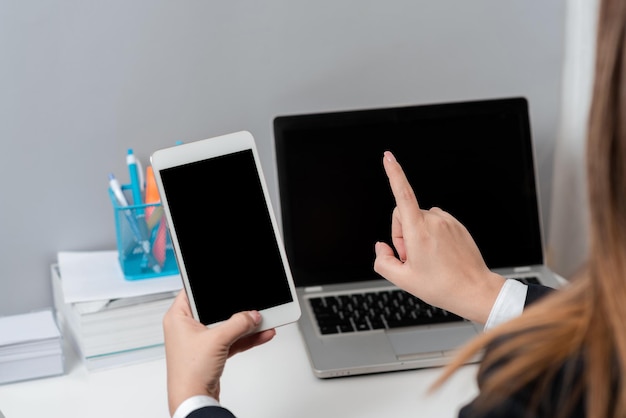 Businesswoman Holding Tablet And Pointing With One Finger On Important Message Executive In Suit Presenting Crutial Information Woman Showing Critical Announcement