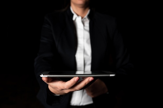 Businesswoman holding tablet and presenting important informations woman showing recent updates