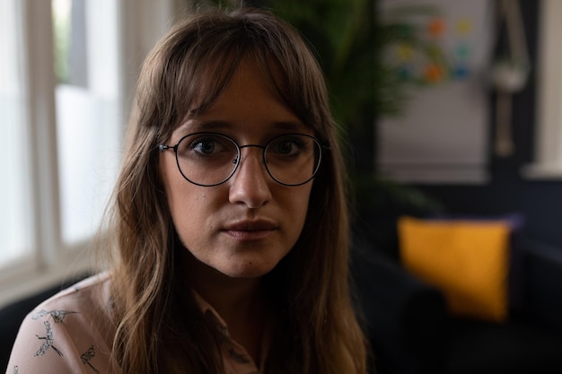 Businesswoman looking at camera in a modern office