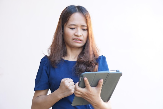 Businesswoman looking at laptop computer screen desperately losing business