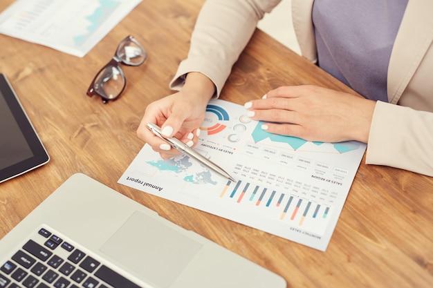 Businesswoman Pointing at Graph Close up