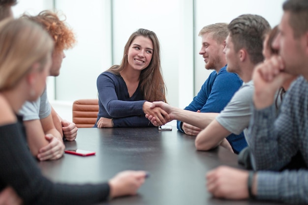 Businesswoman shaking hands with a colleague during a working meeting