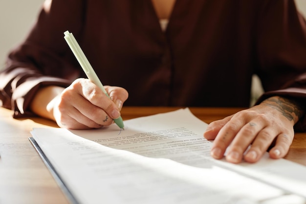 Businesswoman Signing Document Close Up