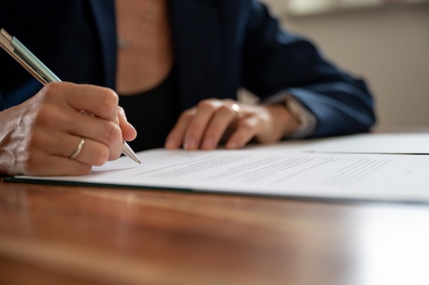 Businesswoman signing a document