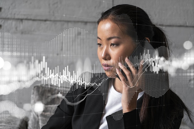 Businesswoman speaks phone and stock market financial chart hologram Double exposure Online trading bonds shares and currencies concept