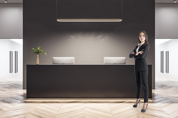 Businesswoman standing in office lobby